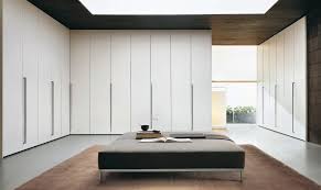 Installing a wall of cabinets is one of our top laundry ideas. Modern White Walk In Closet With Floor To Ceiling Storage Modern Closet Miami By Arredo Casa Group Houzz