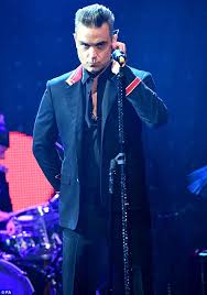 robbie williams new single party like a russian limps into