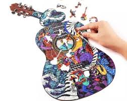 A performance of music or poetry, usually given by one person or a small group. Music Puzzle Etsy