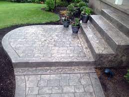 Just by having the style you want to be stamped onto the concrete with your choice of color tones. A Detailed Walkway And Steps Can Add So Much Richness To Your Front Porch Concrete Front Steps Stamped Concrete Walkway Front Walkway Landscaping