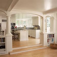 Designer sarah richardson gives this small, open, white kitchen a cheery feeling with pops of sunny yellow while the gray stone floors ground the space. Pony Walls How To Use Half Walls To Define Individual Spaces