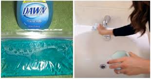 A tub and tile cleaner can help remove mineral buildup. Clean Your Bathtub With A Broom And Dish Soap To See Soap Scum Disappear