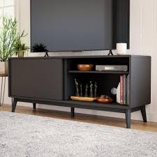 Primed to avoid yellowing on knots.middle door(s) slide side to side to reveal shelf storage. Tv Stands Living Room Furniture The Home Depot
