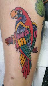 If the original reference is a male eclectus parrot, the final tattoo could appear in green color. Cool Parrot Tattoo Design For Leg Calf By Dave Winn