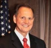 Moore Sees "Moral Crisis" and Mulls Run for Presidency