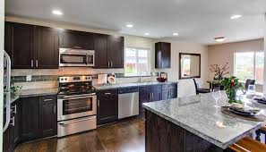 Secrets To Making Your Kitchen Look Bigger Cabinet Refacing Wholesale Kit Kitchen Cabinets Without Crown Molding Custom Kitchen Cabinets Custom Countertops