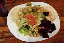 Jaco rustico offers typical food buffet style just steps from the beach. Taco Bar