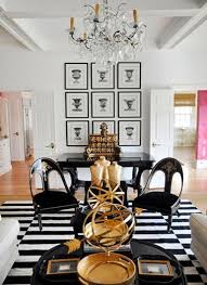 Black Lacquer Furniture A Beautifully Arranged Set Of Antique Prints A Few Golden Accessories And A Black And White S Gold Living Room Home Decor White Decor