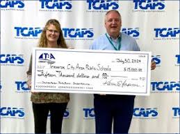 TBA Credit Union strengthens community ties with annual TCAPS donation