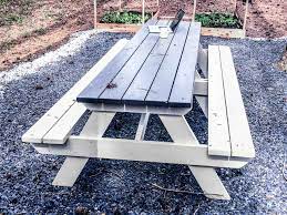 If the finish on your wooden picnic table is nearing its end, rejuvenate the table by sanding it and applying fresh stain and wood sealer. How To Diy Finish An Outdoor Picnic Table By Myoutdoorplans Building Our Rez