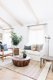 Light Airy Neutral Living Room With Navy Accents Sea Grass Rug Natural Colored Beams Round Wooden Cof Farm House Living Room Home Decor Natural Home Decor