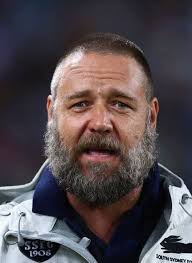 Russell Crowe shocks fans as he's mistaken for John Goodman during a TV  appearance after debuting clean-shaven look: 'I wondered who it was!'