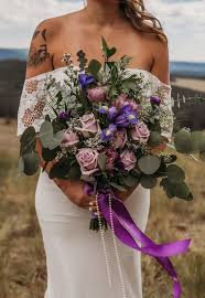 Flowers like lavender, veronica, lisianthus can easily add a whimsical touch. Lavender Bridal Bouquet In Springerville Az The Flower Box