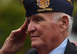 U.S. Air Force veteran Chris Vaia, renders a salute