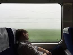 Man Sleeping By A Window Of A High Speed Train Riding Through The Fog Train Rides Speed Training Photo
