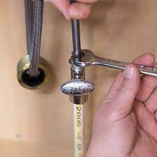 Each supply line is connected to the corresponding valve by a threaded nut. How To Install A Kitchen Faucet Lowe S