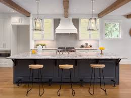 Working zone of modern kitchen with gas stove and utensils. Kitchen Island Guide For Space Storage And Cooktops