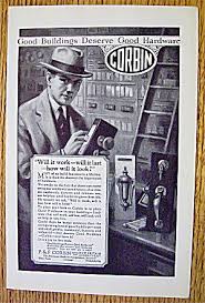 1925 Corbin Hardware With Man Looking At Door Locks