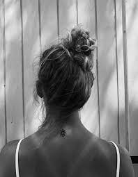 Sun Tattoo At The Back Of The Neck Top Of The Back Behind The Neck Tattoos Sun Tattoo Back Of Neck Tattoo