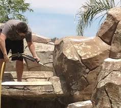 New Sealer Makes Fake Rock Paint Last Over A Decade At Major Theme Parks Rock Waterfall Fake Rock Rock Pools