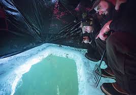 Patient Ice Fishermen Lie Low In Dark Houses To Spear Catch The Blade