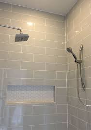 Whilst most people will add a mirror into their space above the vanity unit, adding mirrors to an entire wall will reflect light and pattern in a superb way, making your bathroom look bright and. Linear Light Gray Shower Wall Tile With Hexagon Mosaic Shelf And Ceiling Tile Shower Inspiration Bath Shower Wall Tile Shower Tile Bathroom Shower Tile