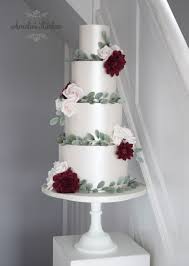 4 Tier Winter Lustred Wedding Cake With Sugar Berried Eucalyptus Roses And Rich Berry Toned Dahlias Deliv Wedding Cake Maker 4 Tier Wedding Cake Wedding Cakes