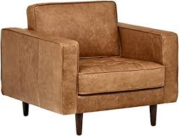 Erick buch designed this ottoman about 1950 for oddense maskinsnedkeri ( o.d. Amazon Com Amazon Brand Rivet Aiden Mid Century Modern Tufted Leather Accent Chair 35 4 W Cognac Leather Furniture Decor