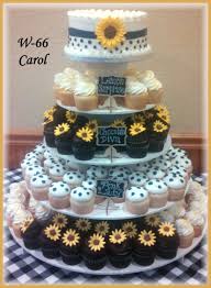 Navy Blue And Yellow With Sunflowers Give This Wedding Cake And Cupcakes Their Pop Of Color Wedding Cakes Blue Navy Blue Wedding Cakes Sunflower Wedding Cake