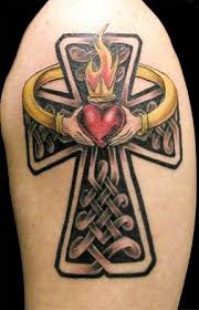 Black celtic claddagh with clover leafs tattoo on upper back Top 9 Prettiest Claddagh Tattoo Designs Styles At Life