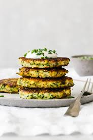 Need a good home for all that zucchini and corn? Zucchini Fritters Gluten Free Low Carb Keto Downshiftology