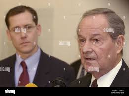 Indiana Gov. Frank O'Bannon, right, announces that the Interstate 69  extension through Southwestern Indiana would pass near the cities of  Bloomington and Washington, during a news conference in Evansville, Ind.,  Thursday, Jan.