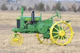 1931 John Deere GPWT with very rare potato wheels, front and rear PTO and  power lift. Although converted to top steer, the owner has the original  complete front side steer pedistal to