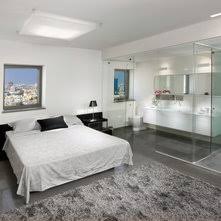 Privacy be damned, this home is about maximum exposure. Master Bedroom With Open Bathroom