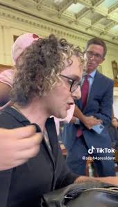 Activist wrestles with Texas official in drag show hearing