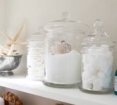 I like that the inside of the canister is white. Classic Glass Bathroom Canisters Pottery Barn