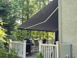 Eastern Sunflexx Retractable Awning On A Stucco Home Kreider S Canvas Service Inc Stucco Homes Retractable Awning Awning