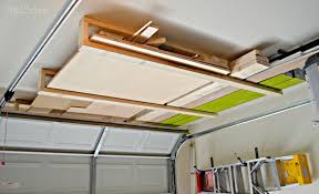 The wooden overhead garage storage shelves are designed to fit into that unused space above the garage doors (you need 16 in. Nine Tips To Get Your Garage Organized Lumber Storage Rack Lumber Storage Garage Storage Organization