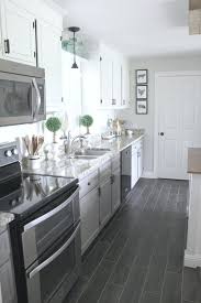 If you're concerned about the longevity of hardwood or tile in your kitchen, get the look of a stylish product with enhanced durability in options such as laminate or vinyl. Diy Flooring How We Changed Our Kitchen In 3 Days For Less Than 400 Noting Grace