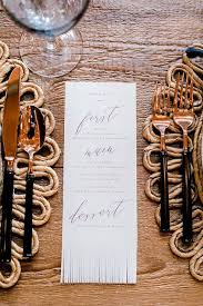 A mason jar becomes your sweet, country wedding invitation. Fringe Dinner Menu By Maria Bond Design Captured By Melissa Gebert Photography Southwest Wedding Wedding Stationery Wedding Inspiration