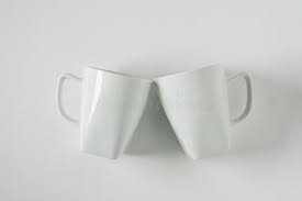 With delicate designs and fine lines, mugs of durable bone china make every occasion feel special. White Coffee Mugs On White Background Clinking In Cheers With Empty Copy Space Stock Photo Image Of Beverage Blank 152982720