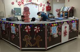 This gingerbread house cubicle gets the award for best use of balloons. Nursing Station Holiday Decorating Our Little Gingerbread House Office Christmas Decorations Christmas Cubicle Decorations Christmas Desk Decorations