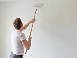 Timber log is the ideal wall painting colour idea for your dining room, since it emits a sense of security and home. Caucasian Man Painting A Wall With A Paint Roller Stock Image Image Of Adult Building 145298101