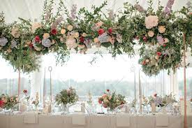 Flowers are beautiful, artful, and a special way to make your wedding come to life. Large Flower Arrangement At A Wedding Reception In A Tent Stock Photo Offset