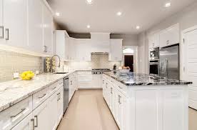 White Kitchen With Gray Glass Backsplash And Granite Countertop Contemporary Kitchen