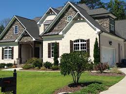 Here is another house that is using a white stucco color but it is a softer, more warm white than we saw in the previous example. White Brick House Brown Grey Accents Chesapeake Pearl 1 Brick Exterior House Exterior Brick White Brick Houses