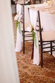 Wedding decoration from the ceremony space to the reception, chair decors are a great way to express your personality on the big day, and many of them can be creative and easy diy projects, from fabric bows, ribbons and flower wreaths. 10 Festive Florals To Adorn Your Wedding Chairs