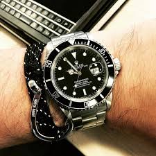 Rolex submariner black index dial stainless steel and 18kt yellow gold oyster bracelet 116613. Rolex Submariner Really Shines Beside A White Gold Hook