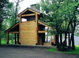 Traditional placing of texas tree on the finished frame in celebration of the barn raising. Traditional Contemporary Texas Barn Geometry