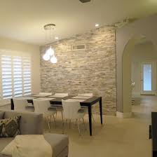 Fine Dining Prosource Wholesale A Stone Accent Wall Adds Texture And Ties The Room S Color Living Room Tiles Tile Accent Wall Tile Accent Wall Living Room